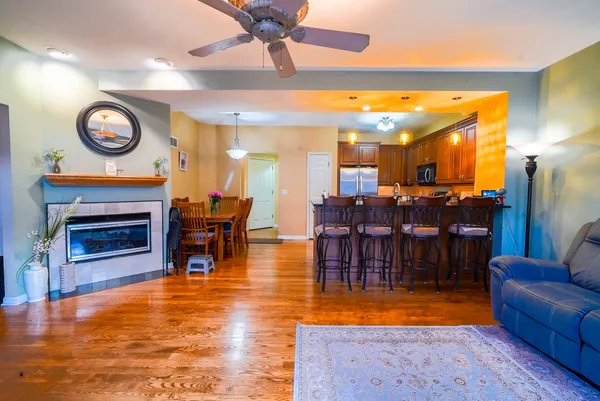 a living room with fireplace furniture and a fireplace