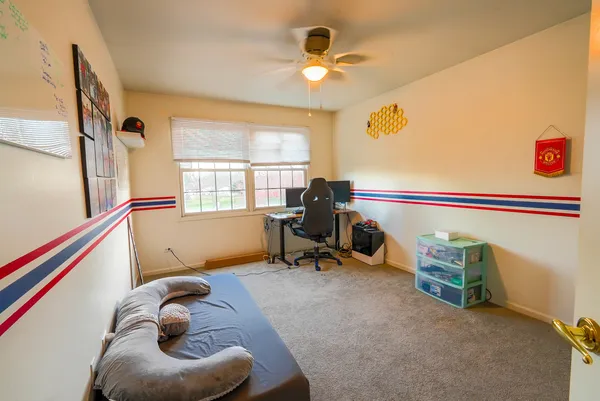 a bedroom with furniture and a window