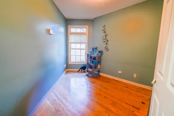 a view of a room with gym equipment and windows