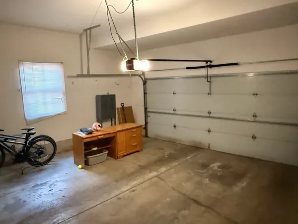 a bed room with a bed and a chair