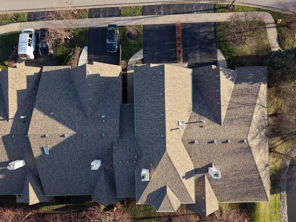 an aerial view of a house with outdoor space