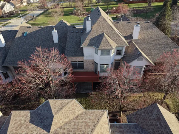 a aerial view of a house with table and chairs