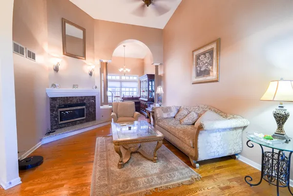 a living room with furniture and a fireplace