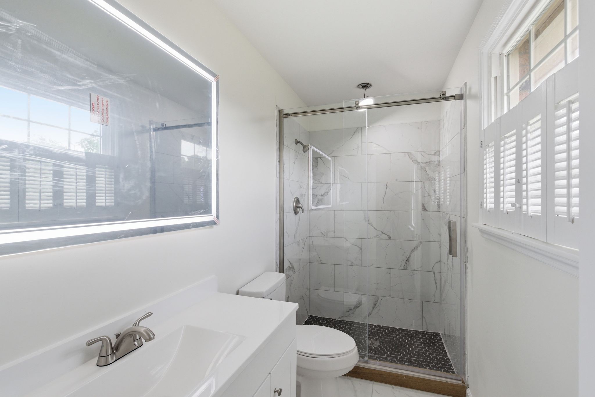 213 Rising Sun Lane Old Hickory, TN 37138 - Photo 22 of 37 a bathroom with a sink toilet a mirror and shower