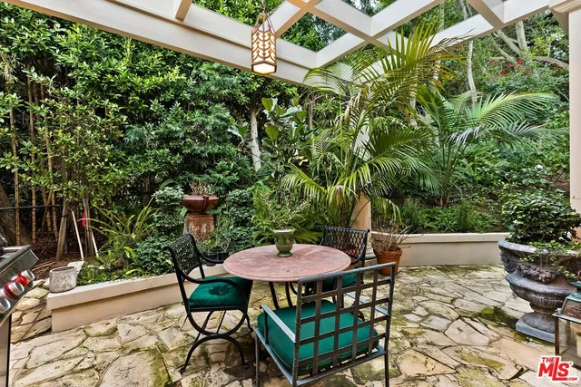 a view of a chairs and table in the patio