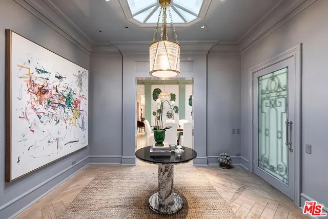 a room with lots of windows and mirrors