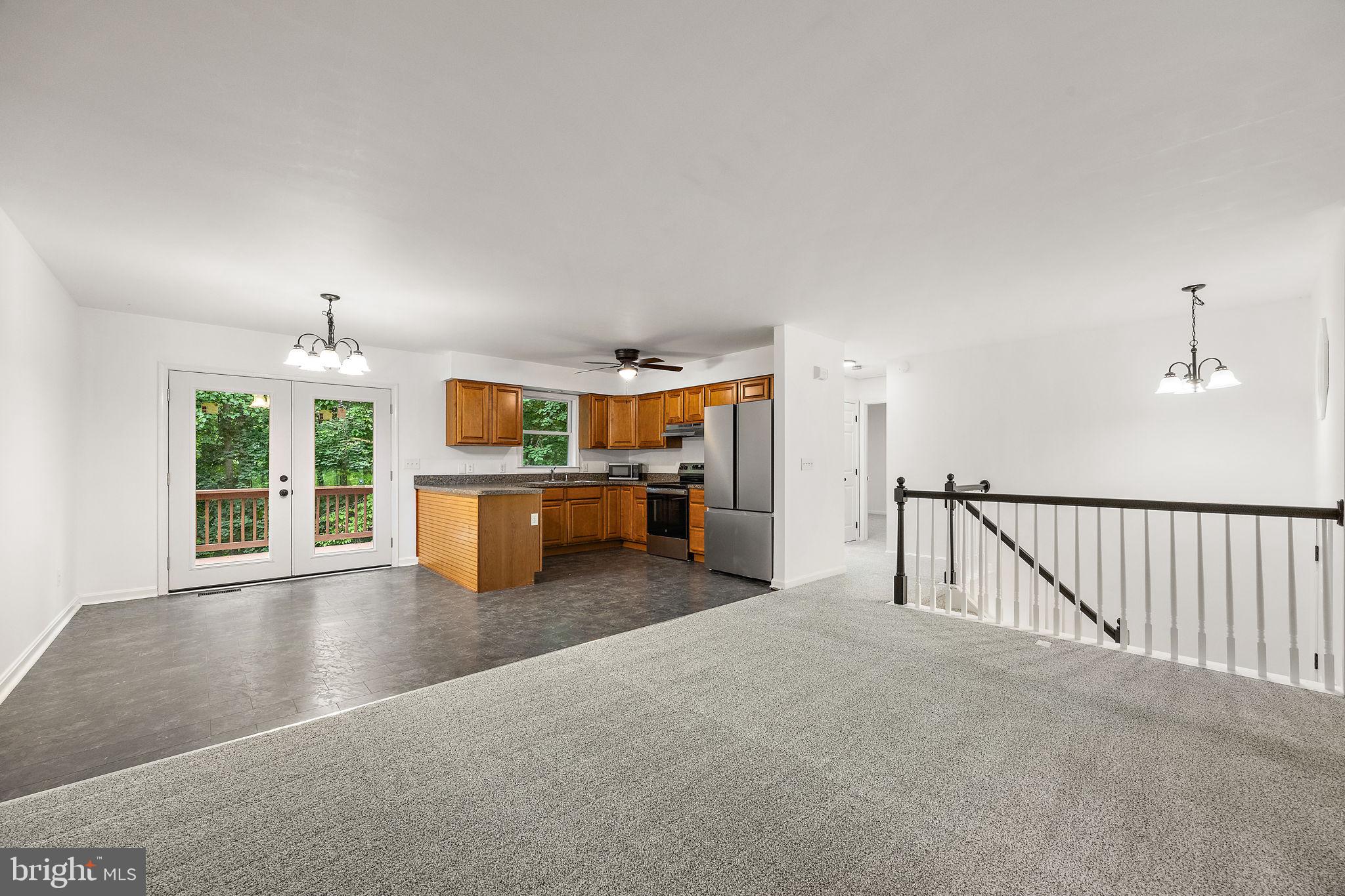 93 Cree Terrace Rising Sun, MD 21911 - Photo 5 of 28 a view of a livingroom with furniture staircase and a kitchen