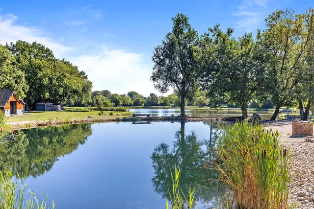 a view of a lake with houses with outdoor space