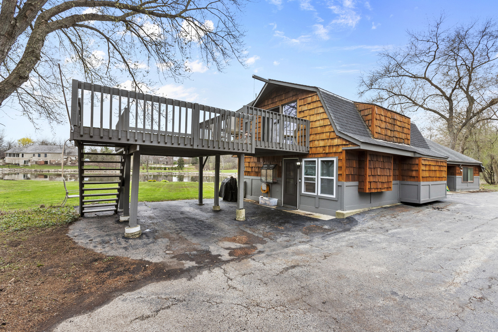 330 South Barrington Road Barrington, IL 60010 - Photo 20 of 39 a view of a house with a yard and roof