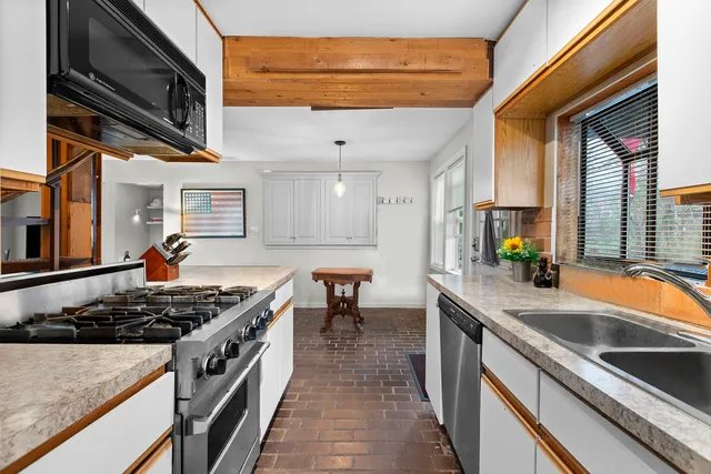 a living room with furniture and a lamp