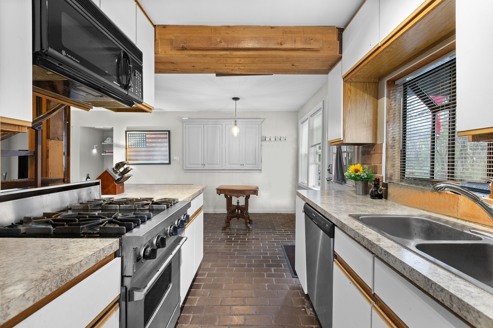 330 South Barrington Road Barrington, IL 60010 - Photo 21 of 39 a kitchen with stainless steel appliances granite countertop a stove a sink and a microwave