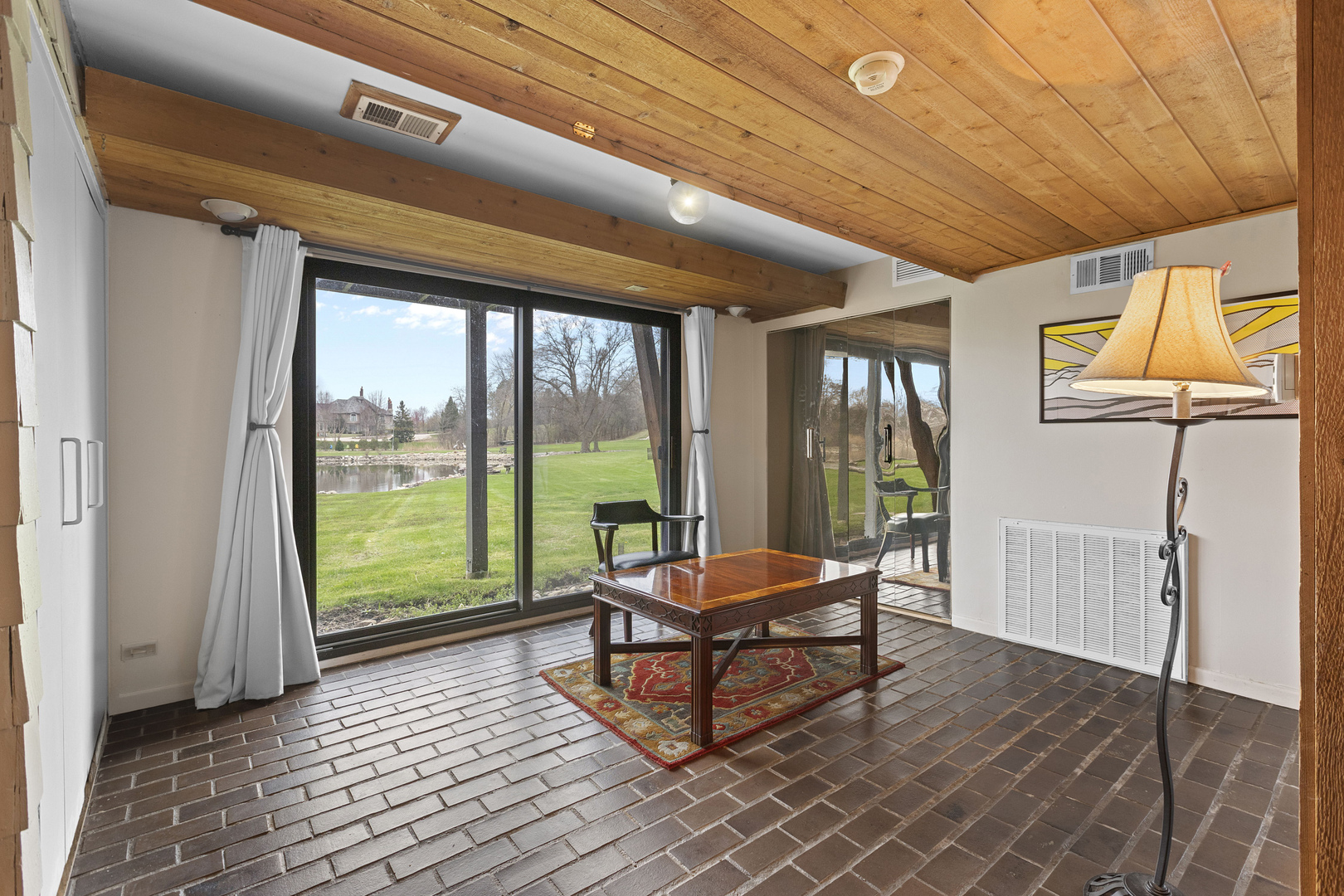 330 South Barrington Road Barrington, IL 60010 - Photo 25 of 39 a living room with furniture and a floor to ceiling window