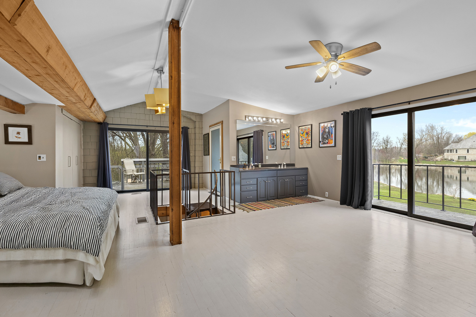 330 South Barrington Road Barrington, IL 60010 - Photo 27 of 39 a spacious bedroom with a large bed and a chandelier
