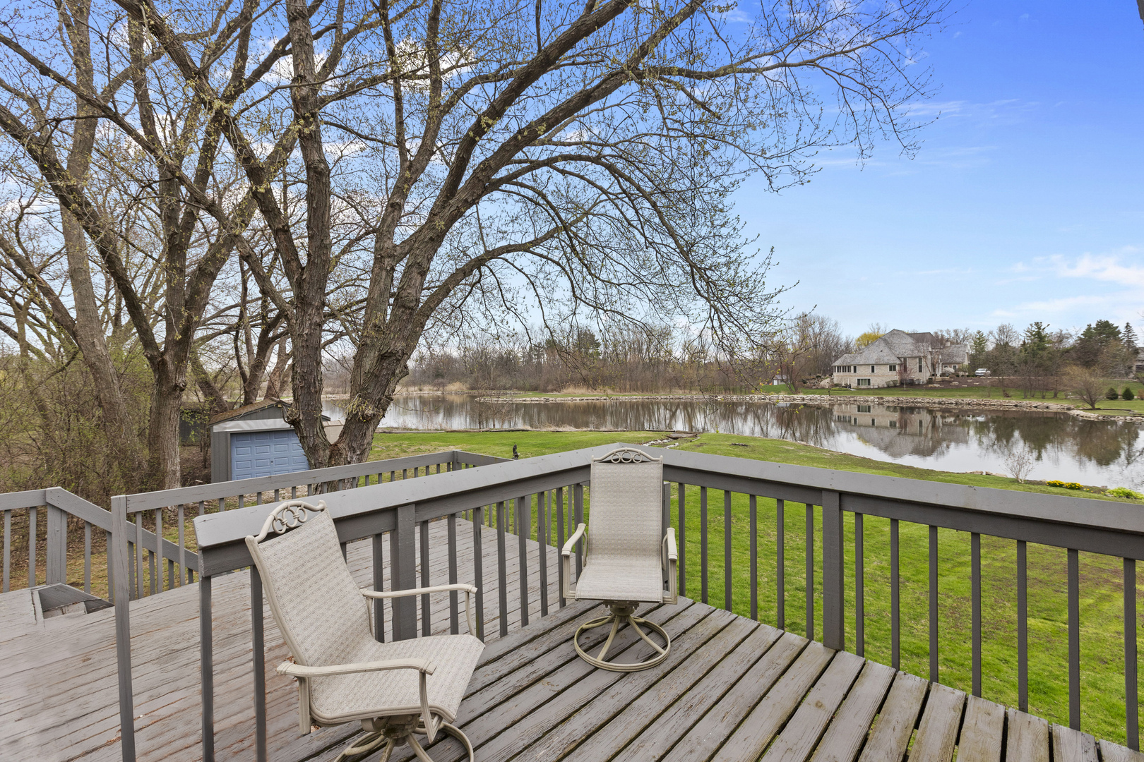330 South Barrington Road Barrington, IL 60010 - Photo 29 of 39 a view of a balcony with wooden floor and fence