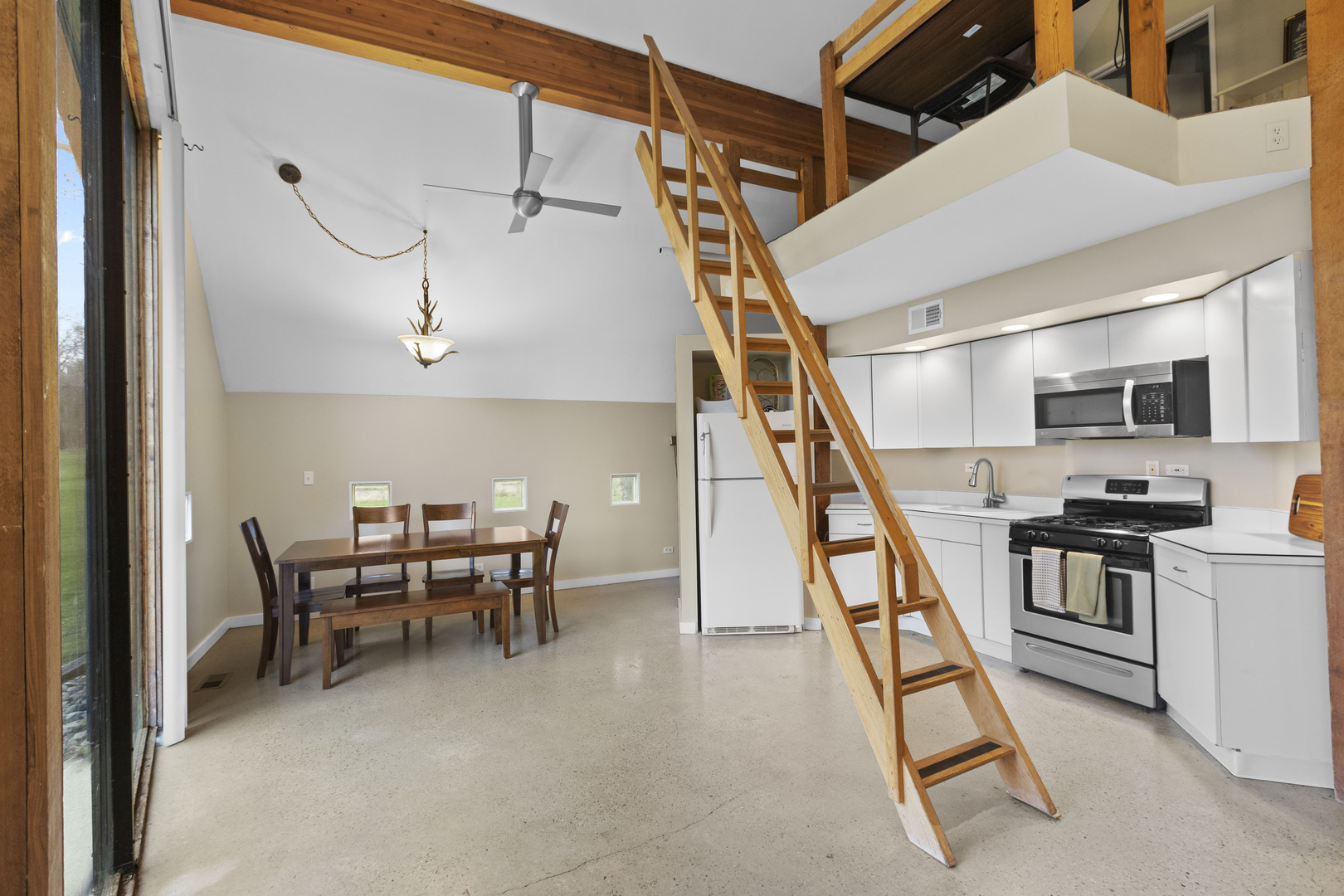 330 South Barrington Road Barrington, IL 60010 - Photo 34 of 39 a dining room with wooden floor and stairs