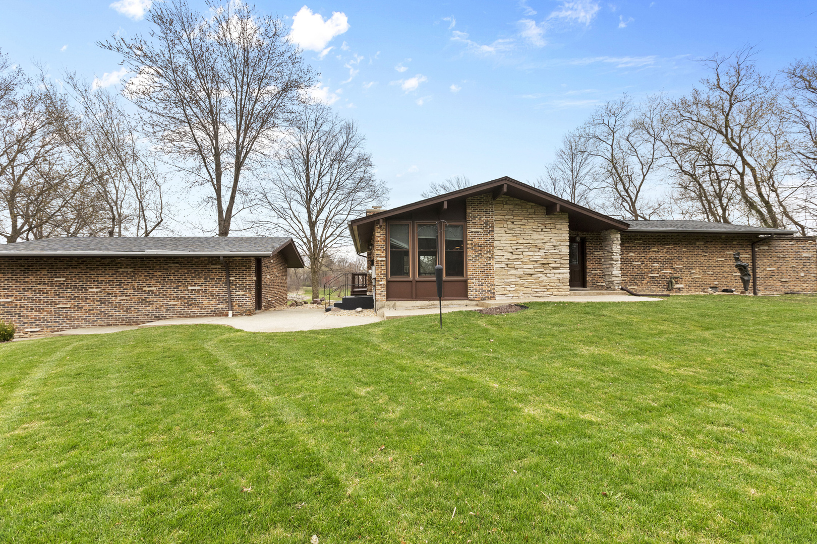 330 South Barrington Road Barrington, IL 60010 - Photo 6 of 39 a front view of house with yard and seating area