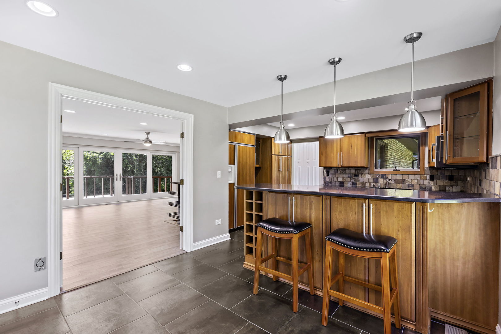 330 South Barrington Road Barrington, IL 60010 - Photo 10 of 39 a view of a kitchen with a table and chairs in it