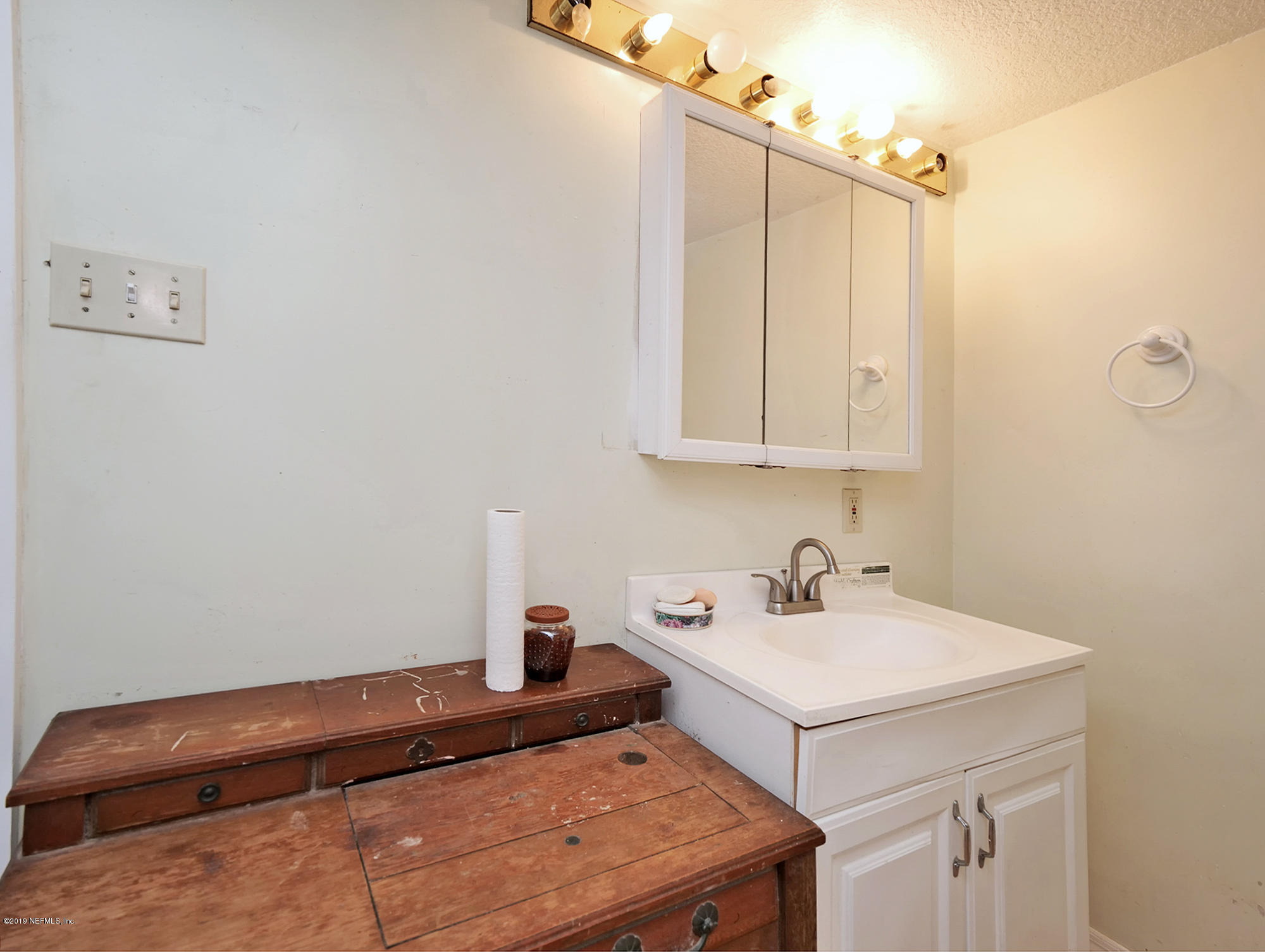 13143 Pate Road West Jacksonville, FL 32226 - Photo 13 of 23 a bathroom with a sink and a mirror