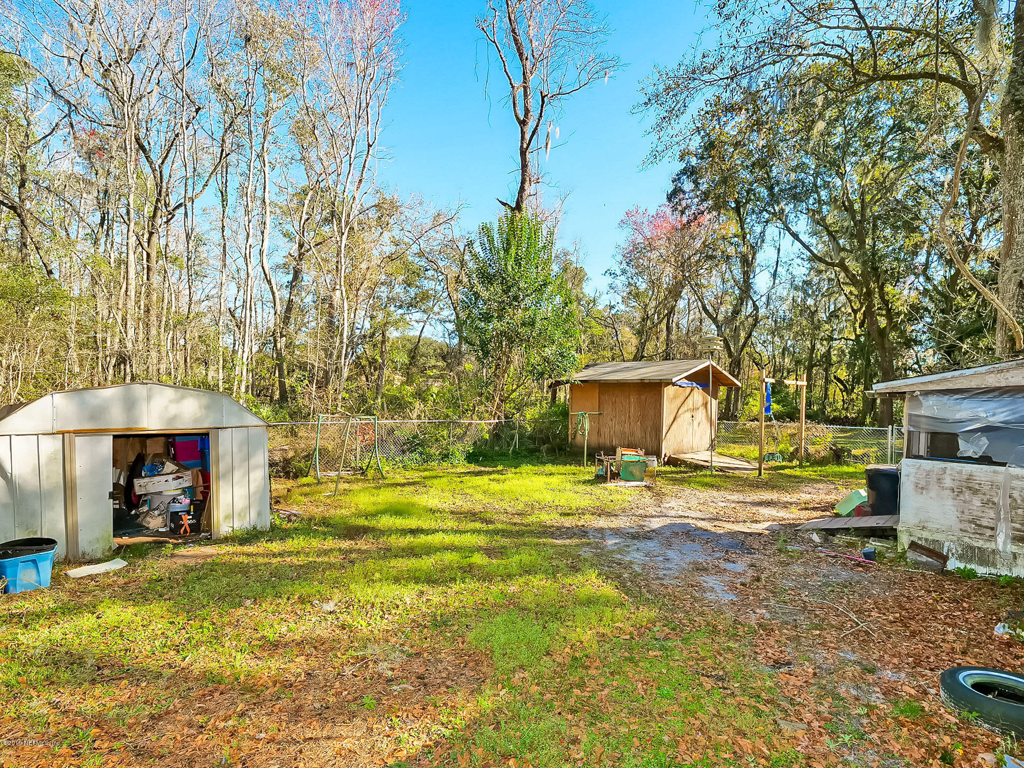 13143 Pate Road West Jacksonville, FL 32226 - Photo 19 of 23 a view of a house with backyard and sitting area