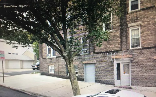 a tree in front of a building