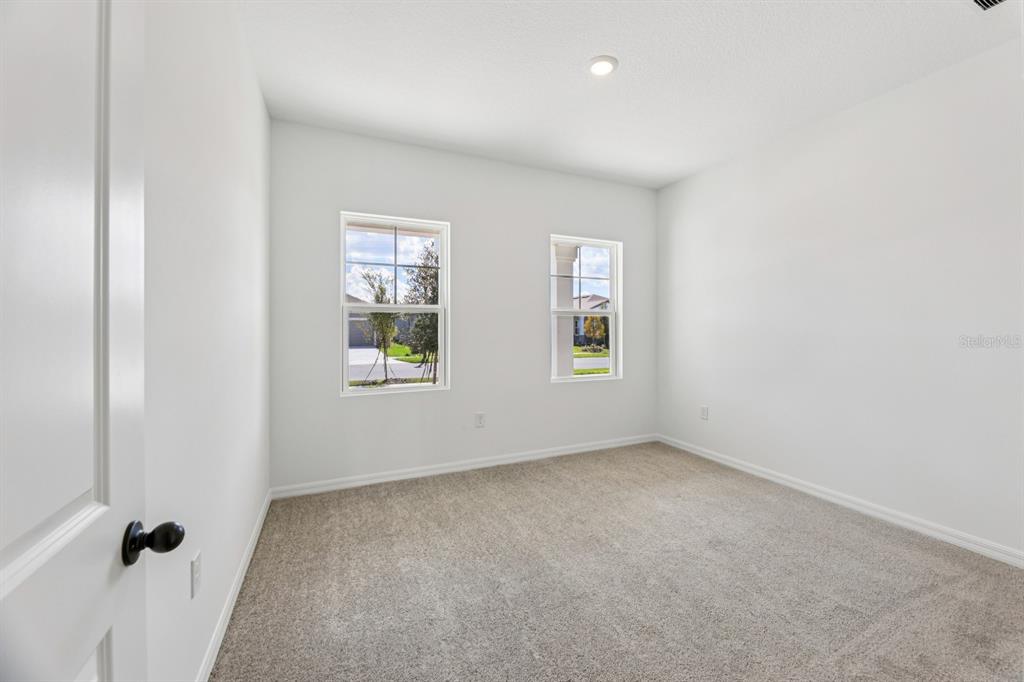 5721 Haystack Drive St. Cloud, FL 34771 - Photo 16 of 36 an empty room with windows