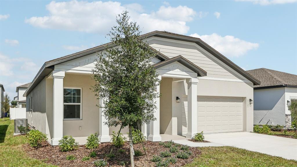 5721 Haystack Drive St. Cloud, FL 34771 - Photo 2 of 36 a front view of a house with a yard