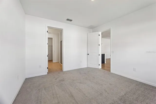 a bathroom with a shower and a sink