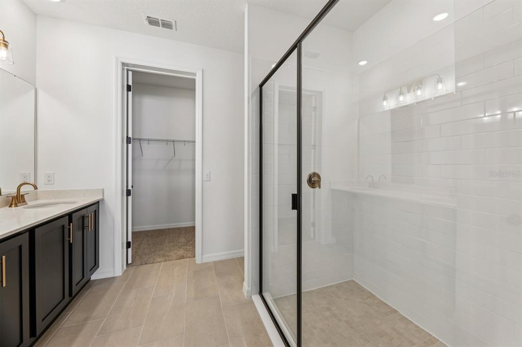 5721 Haystack Drive St. Cloud, FL 34771 - Photo 27 of 36 a bathroom with a shower and a sink