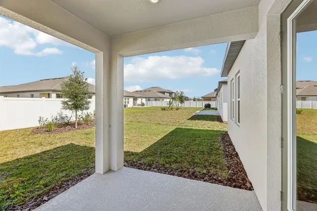 a view of a living room and floor to ceiling window