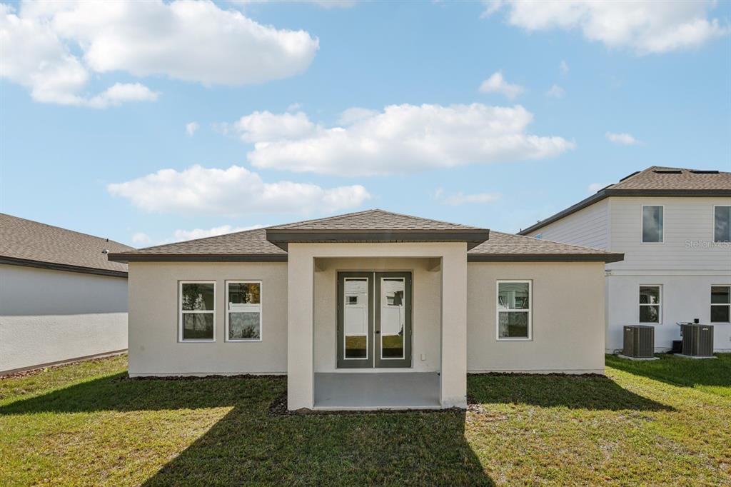 5721 Haystack Drive St. Cloud, FL 34771 - Photo 33 of 36 a front view of a house with a yard