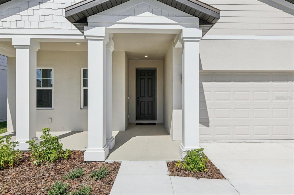 5721 Haystack Drive St. Cloud, FL 34771 - Photo 4 of 36 a entryway with a outdoor space