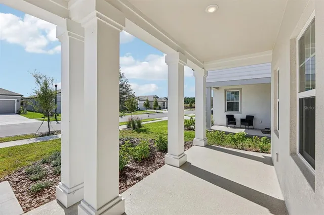 a view of a back yard from a porch