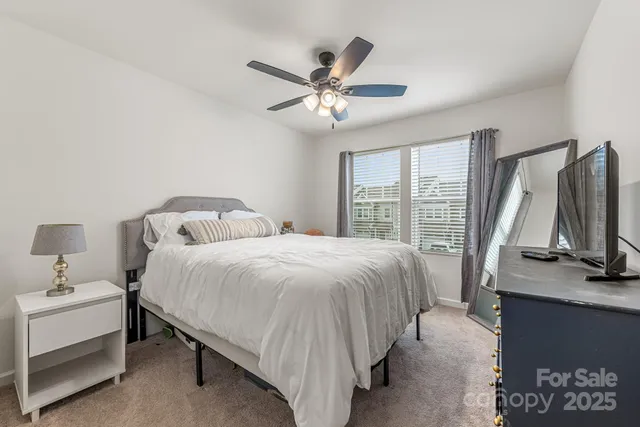 a bathroom with a sink double vanity and a toilet