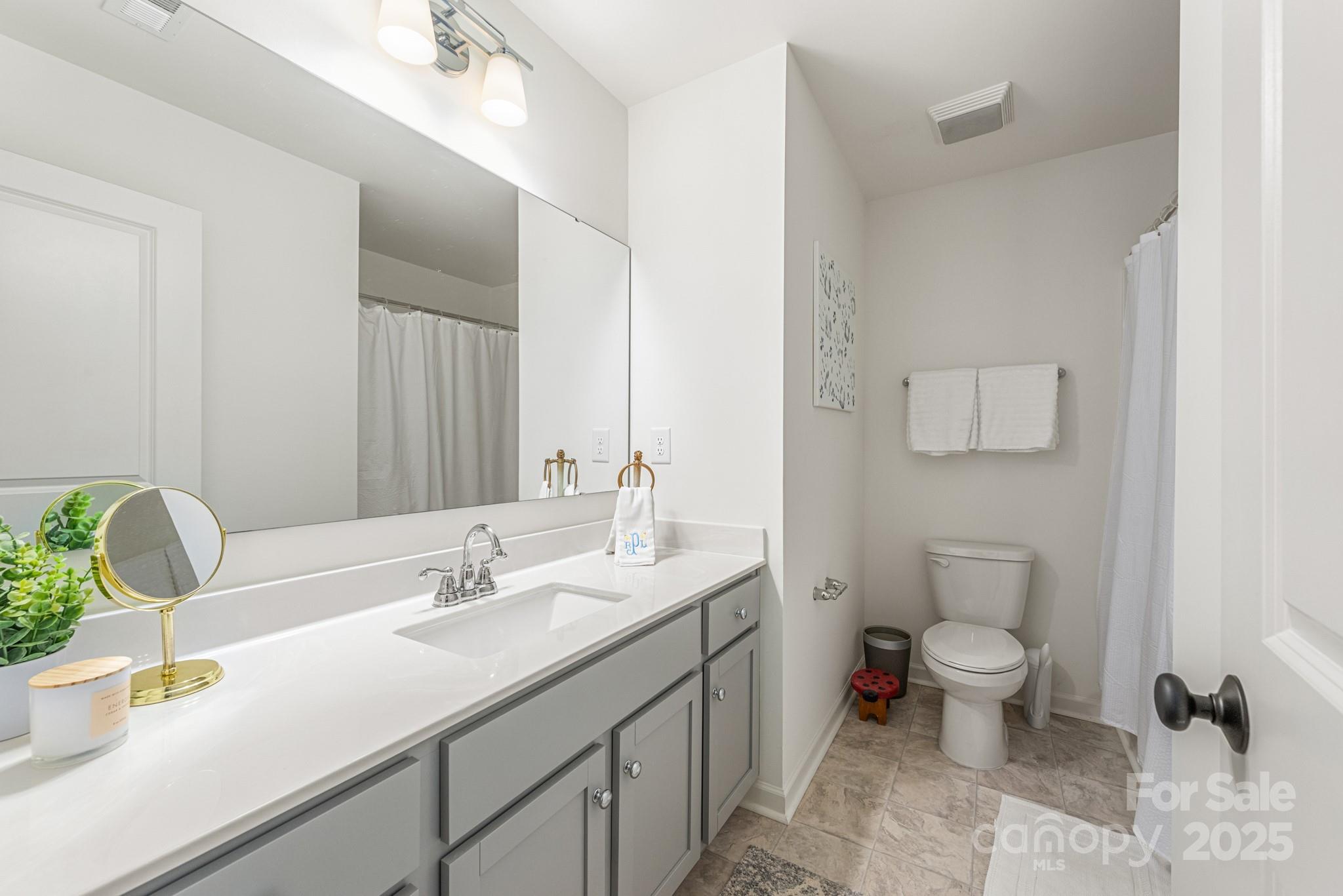 2038 Crooked Oak Lane, Unit 16 York, SC 29745 - Photo 20 of 24 a bathroom with a sink double vanity and a toilet