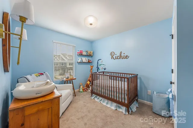 a living room with a couch and a rug