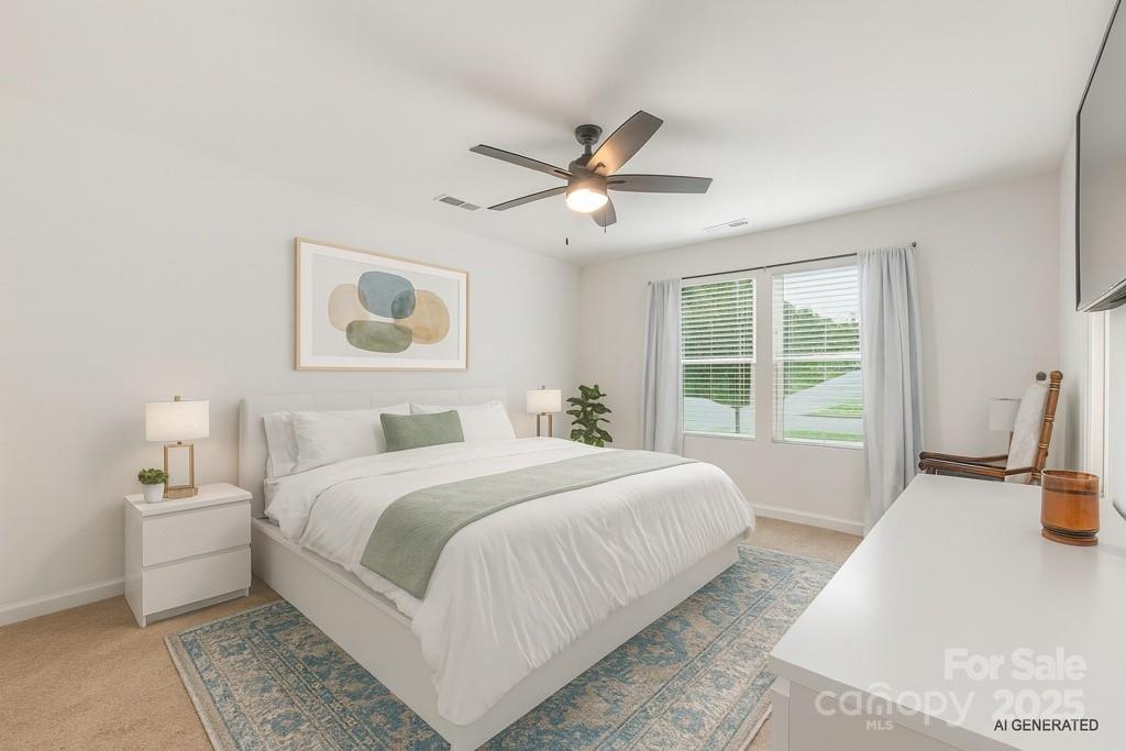 2038 Crooked Oak Lane, Unit 16 York, SC 29745 - Photo 23 of 24 a bedroom with a large bed and a chandelier