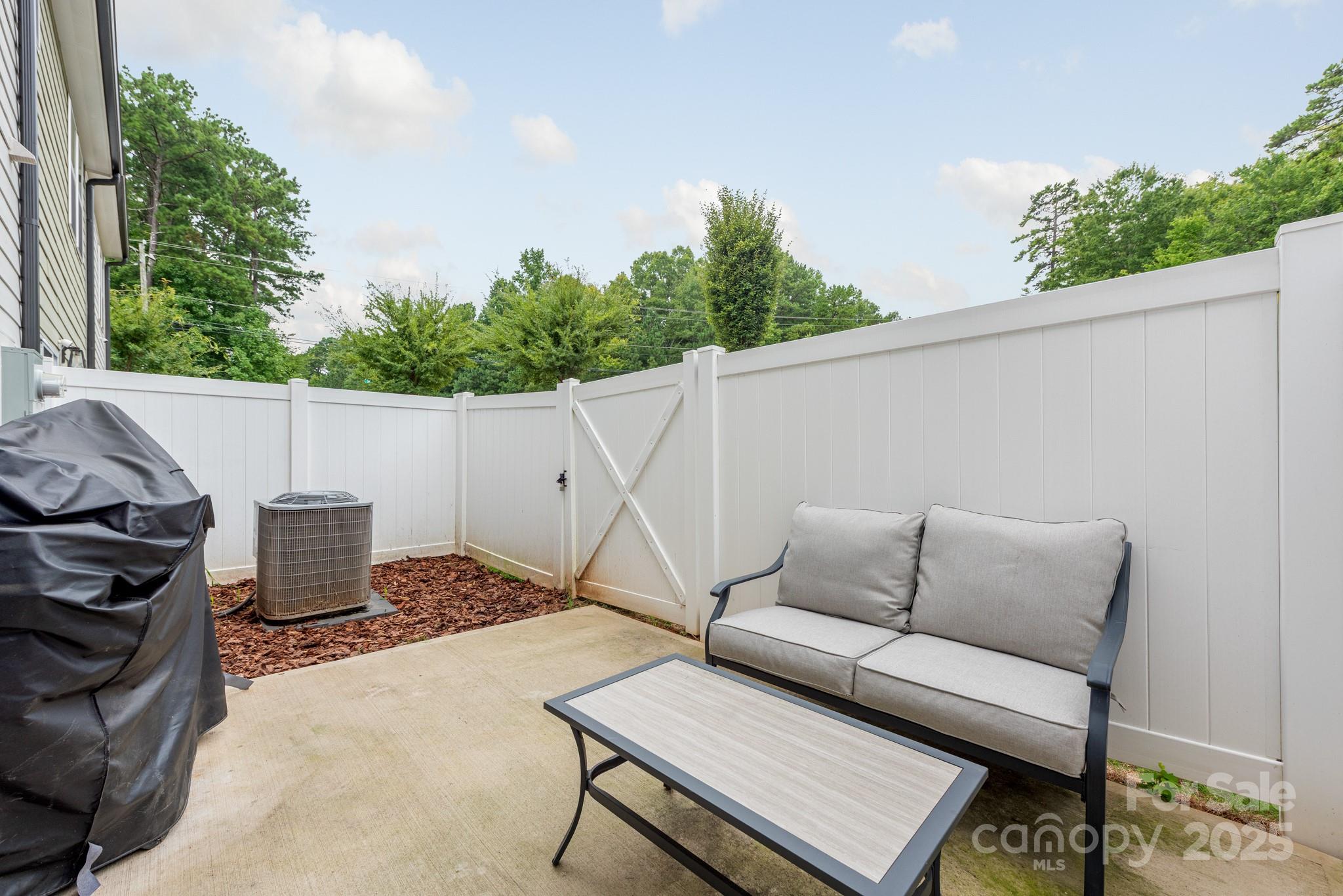 2038 Crooked Oak Lane, Unit 16 York, SC 29745 - Photo 24 of 24 a view of a patio with a couch