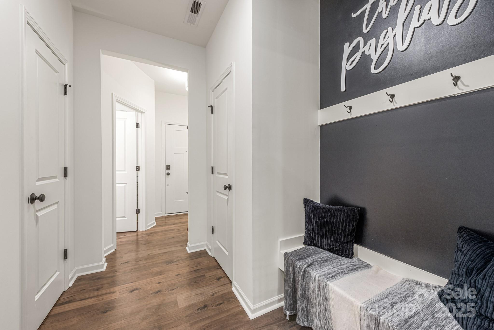 2038 Crooked Oak Lane, Unit 16 York, SC 29745 - Photo 6 of 24 a view of a hallway with bed and wooden floor