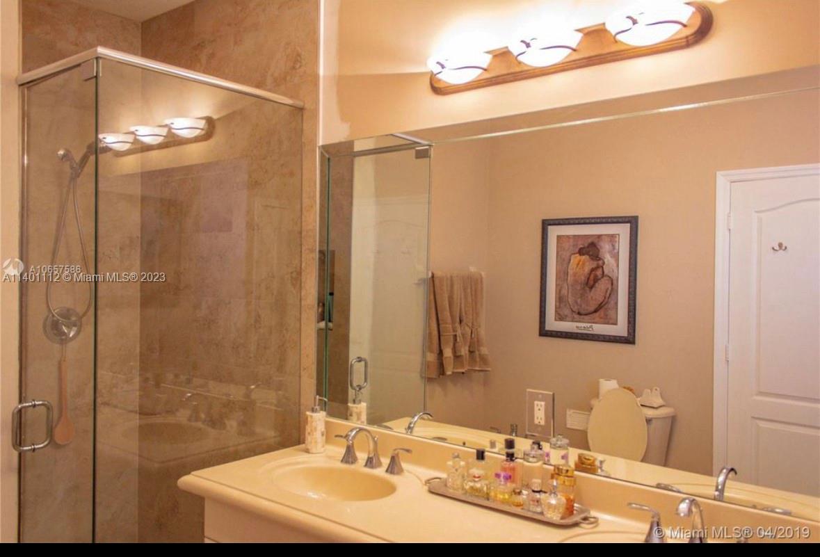 The Hammocks Miami, FL 33196 - Photo 2 of 9 a bathroom with a sink mirror and a shower