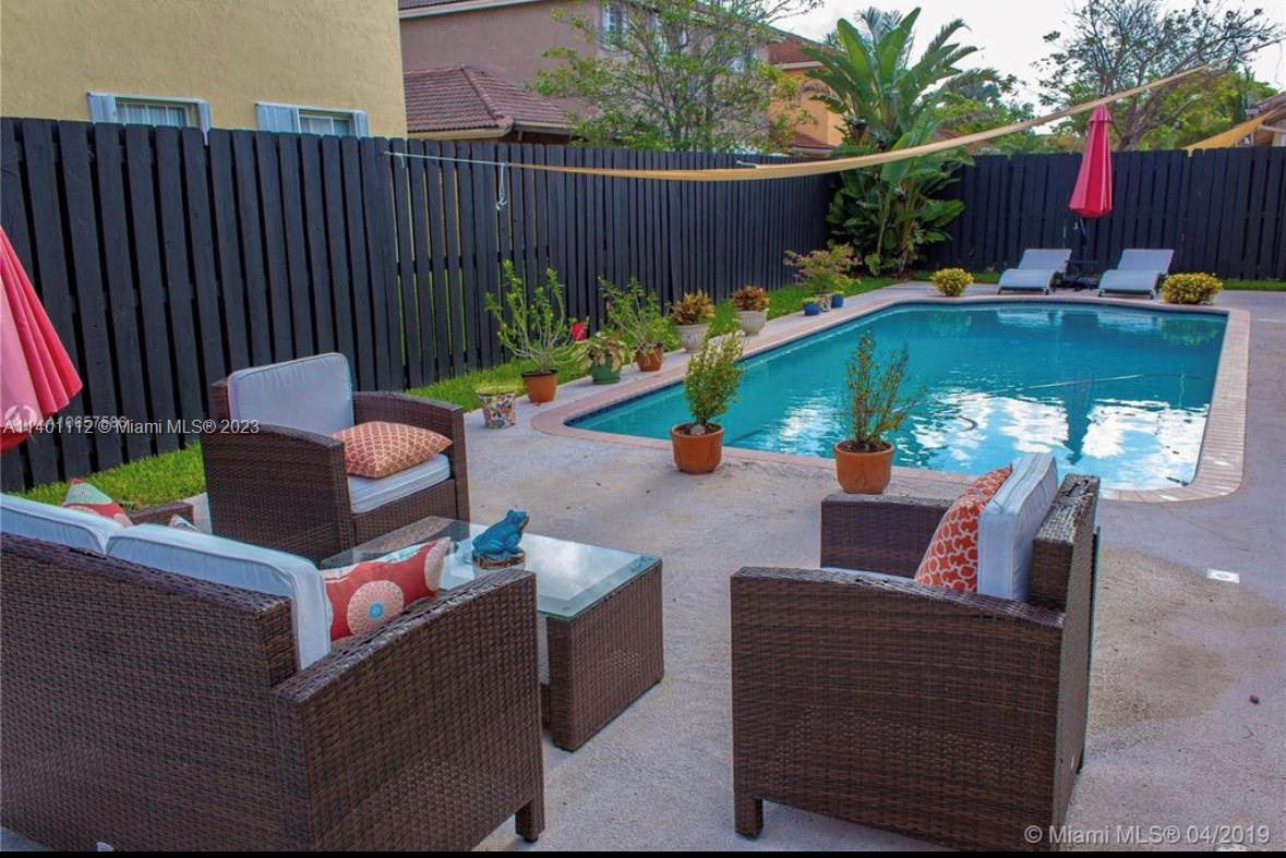 The Hammocks Miami, FL 33196 - Photo 9 of 9 an outdoor sitting area with furniture and garden view