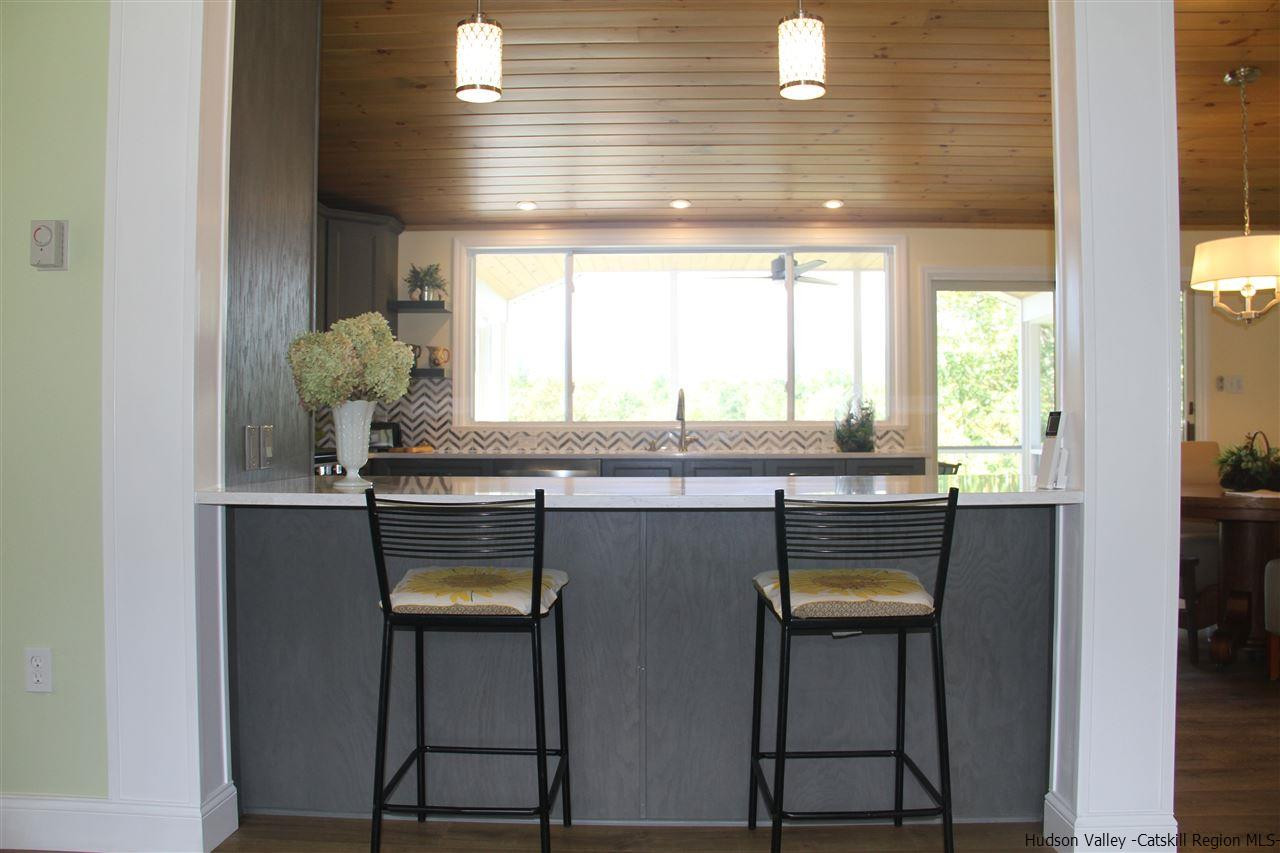 129 Bethel Ridge Road Catskill, NY 12414 - Photo 11 of 35 a kitchen with stainless steel appliances granite countertop a sink and a window
