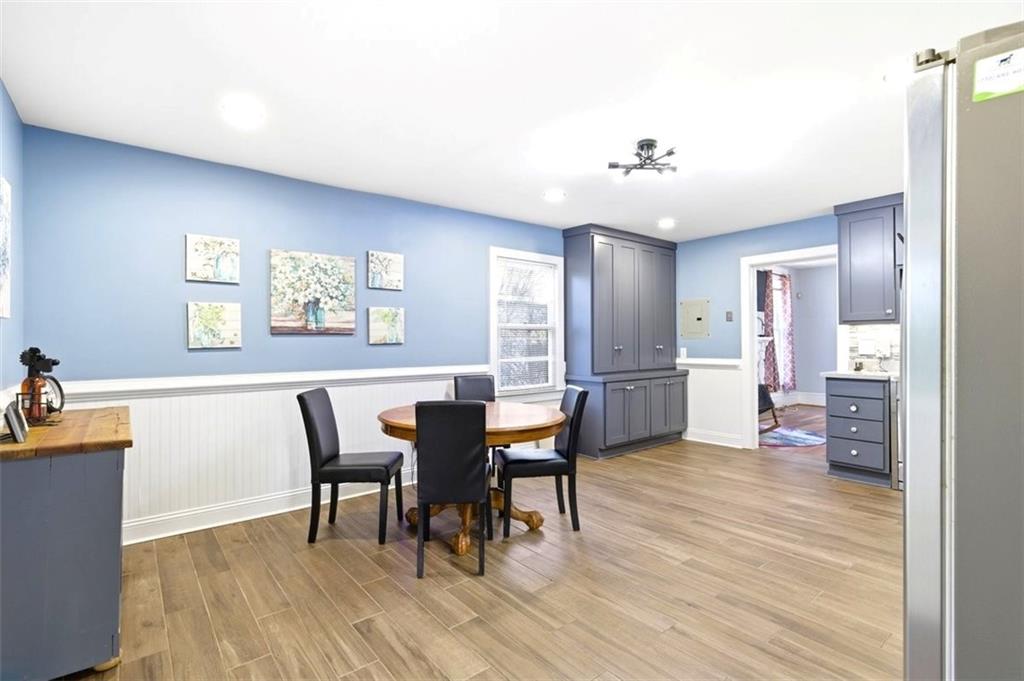 171 Northeast Broad Street Fairburn, GA 30213 - Photo 6 of 15 a view of a dining room with furniture and wooden floor
