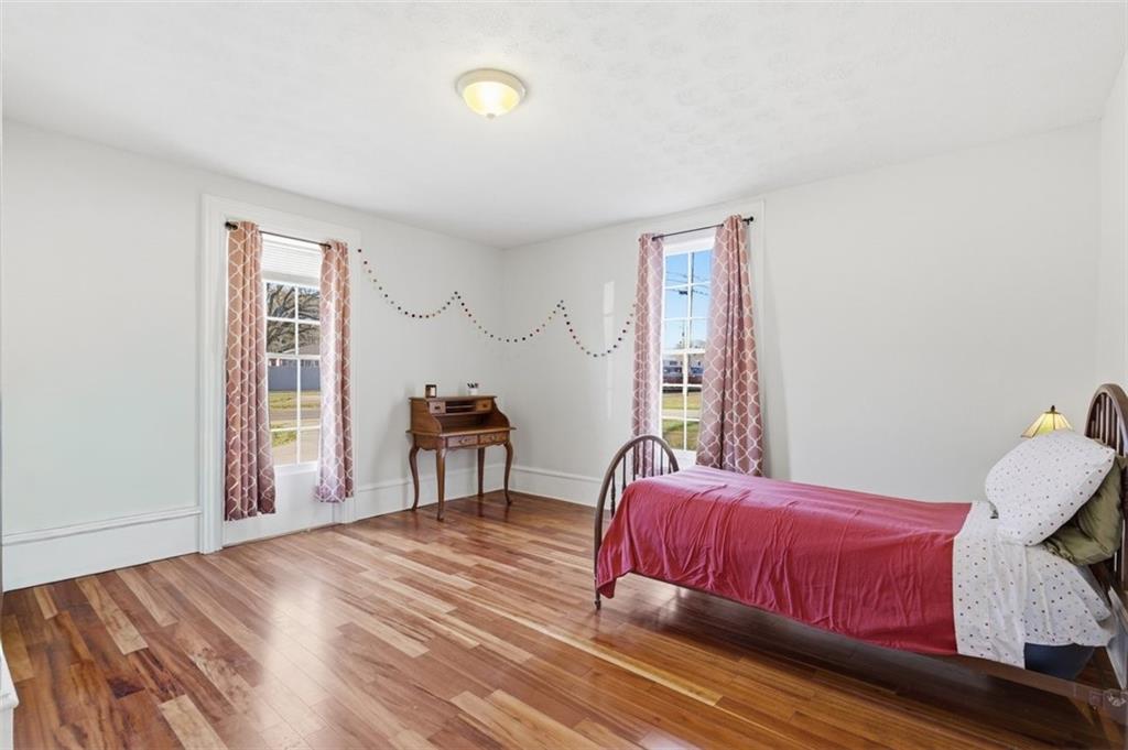 171 Northeast Broad Street Fairburn, GA 30213 - Photo 10 of 15 a bedroom with a bed and a window
