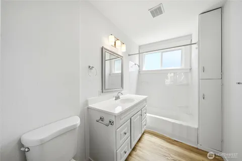 a bathroom with a sink a toilet and a bathtub