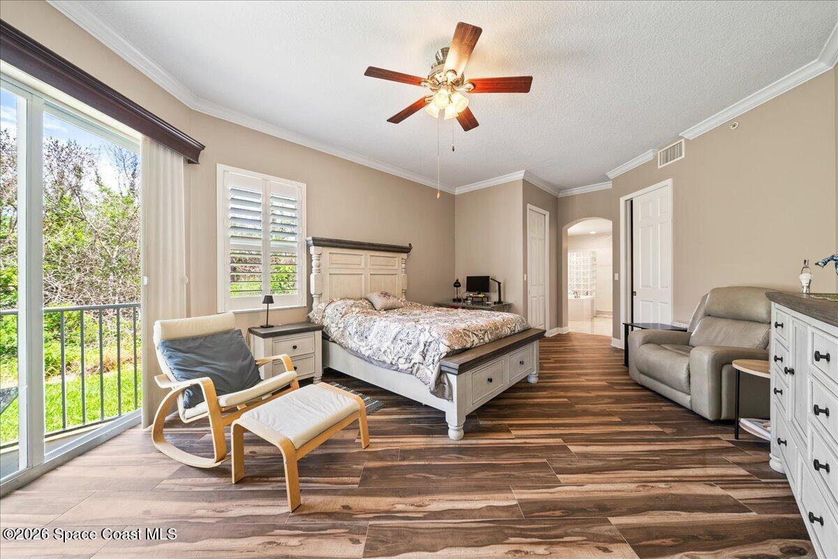 6005 Highway 1, Unit 101 Rockledge, FL 32955 - Photo 19 of 57 a bedroom with a bed and a large window