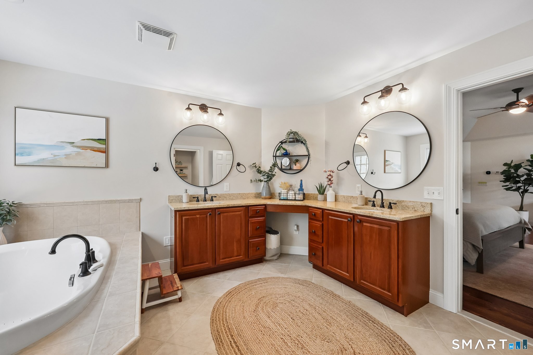 3 East Lake Road Danbury, CT 06811 - Photo 23 of 37 The spacious primary bath features a separate soaking tub, walk-in shower, and double sinks, offering both comfort and functionality in an elegantly designed setting.