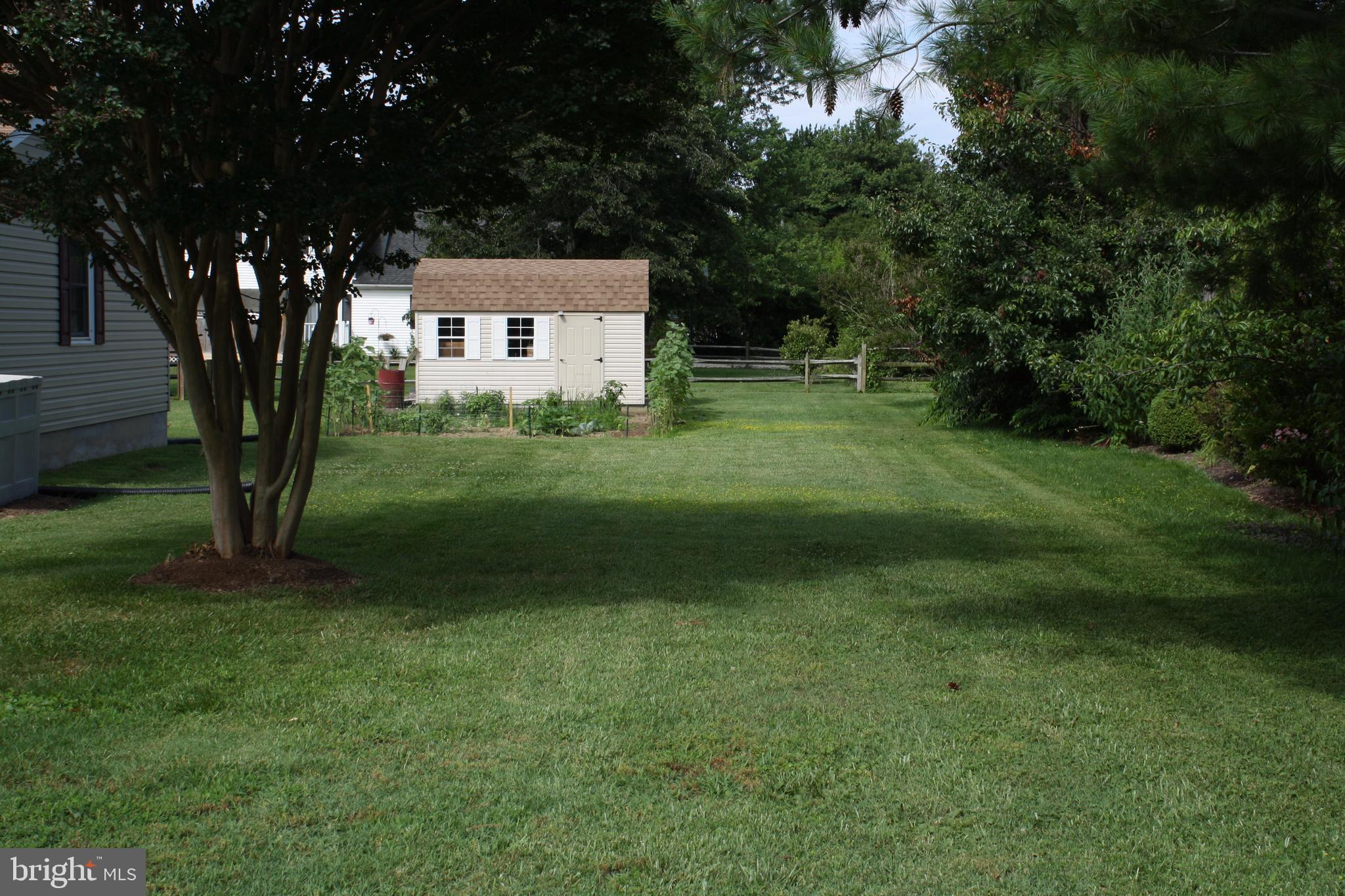 1702 Chester Road Chester, MD 21619 - Photo 1 of 28 Shed w/ electric and view of the vegetable garden