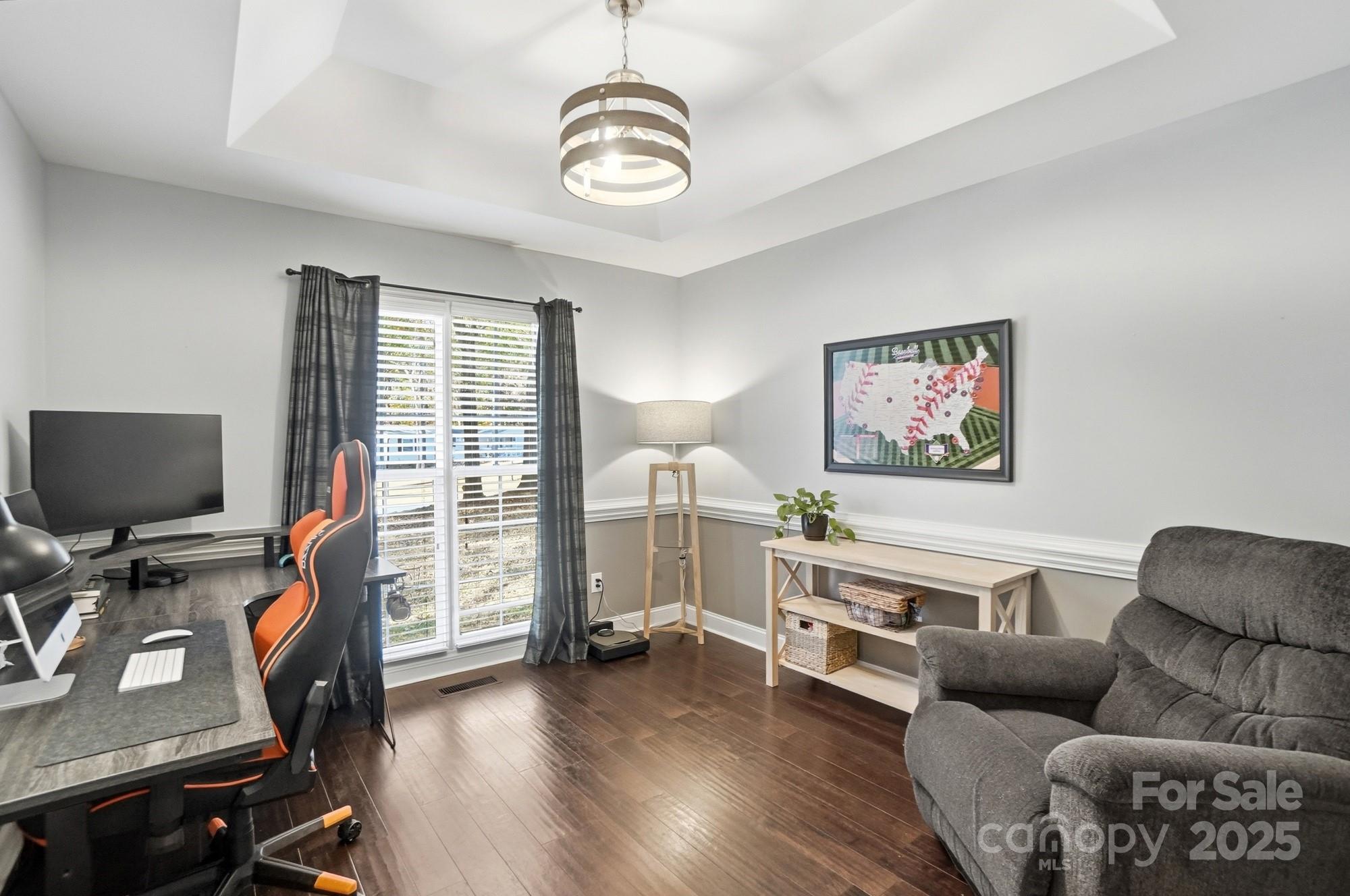 516 Jim Parker Road Monroe, NC 28110 - Photo 14 of 37 a living room with furniture and a flat screen tv