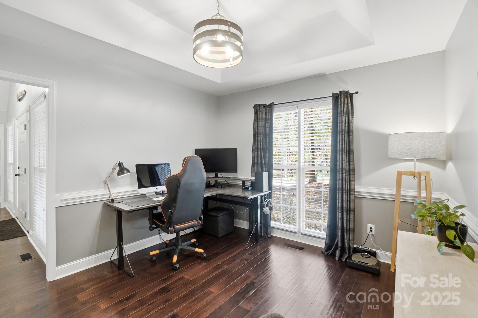516 Jim Parker Road Monroe, NC 28110 - Photo 15 of 37 a view of a workspace with furniture and a window