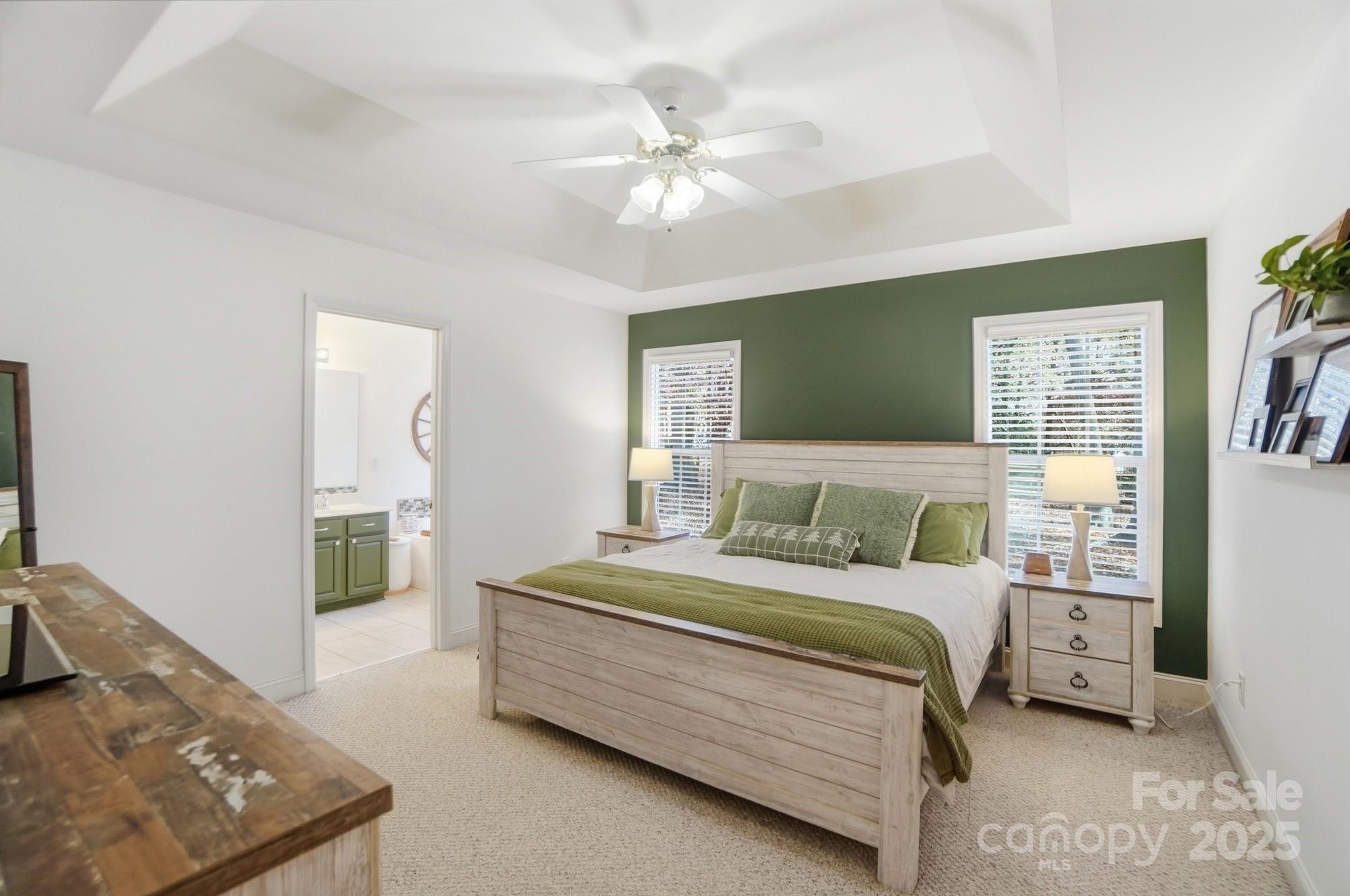 516 Jim Parker Road Monroe, NC 28110 - Photo 16 of 37 a bedroom with a bed and a chandelier